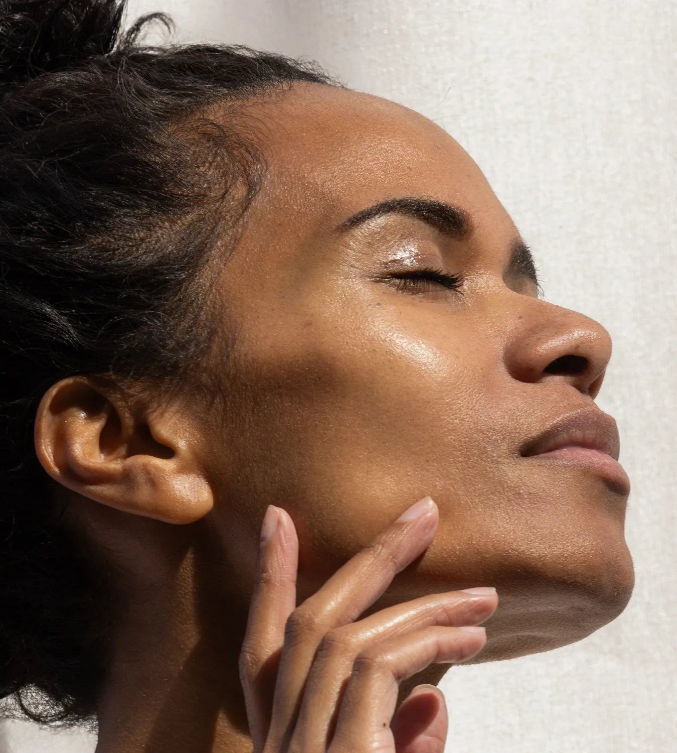 woman posing with glowing skin