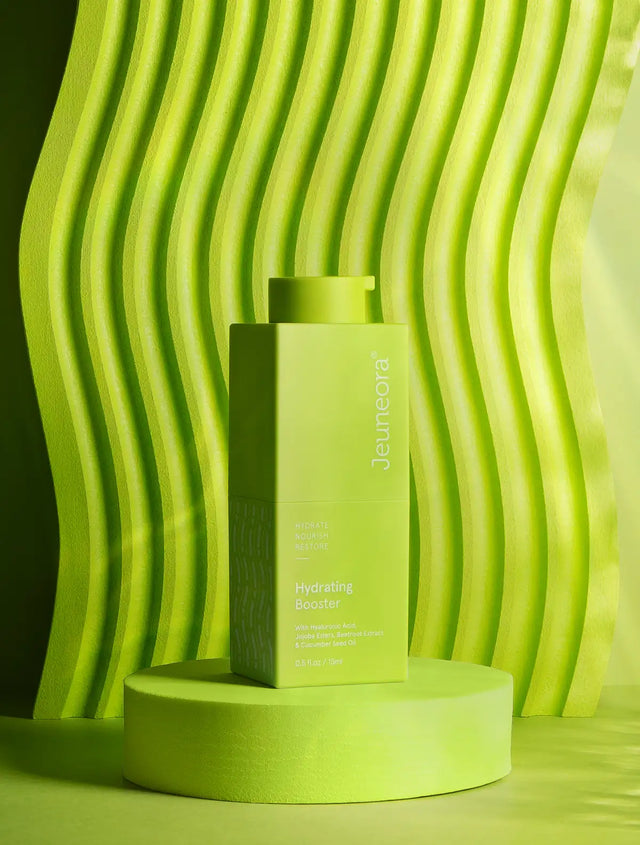 Hydrating Booster serum sitting with green background