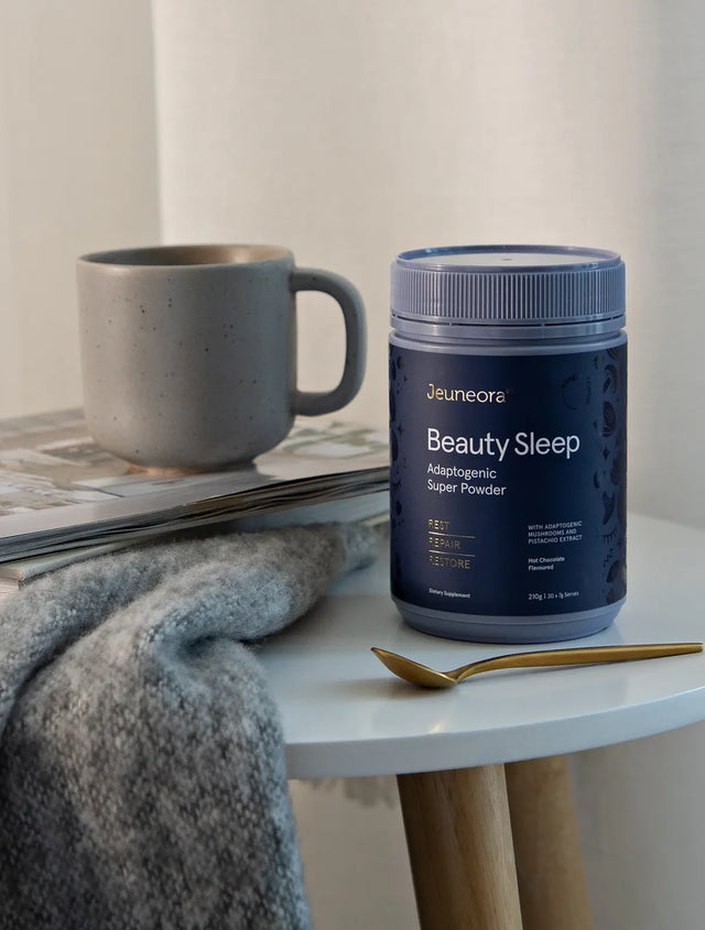 cosy evening set up with a cup of Jeuneora Beauty Sleep Adaptogenic Super Powder