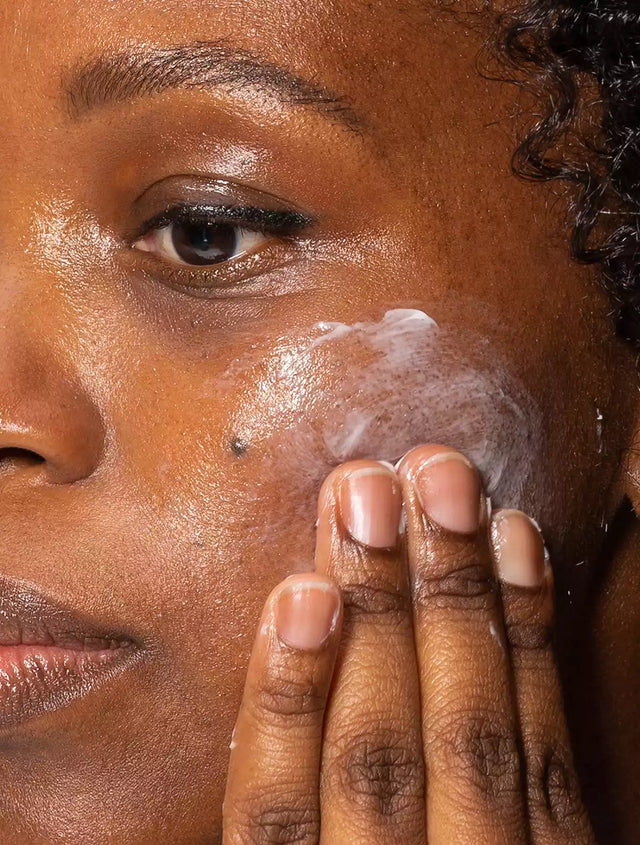 Woman applying GoNightly overnight repair cream